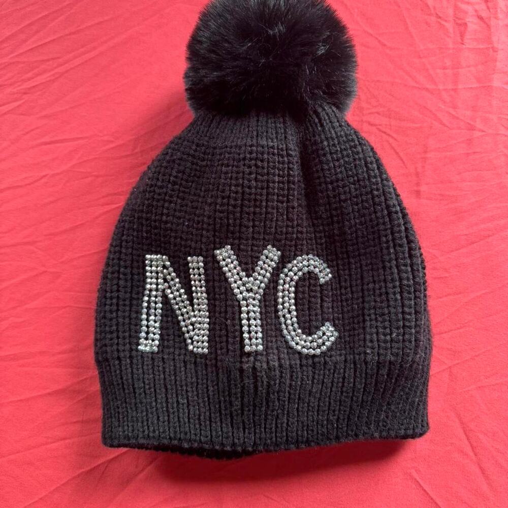 Black & silver beaded NYC hat w pom pom & like a faux fur lining inside the hat